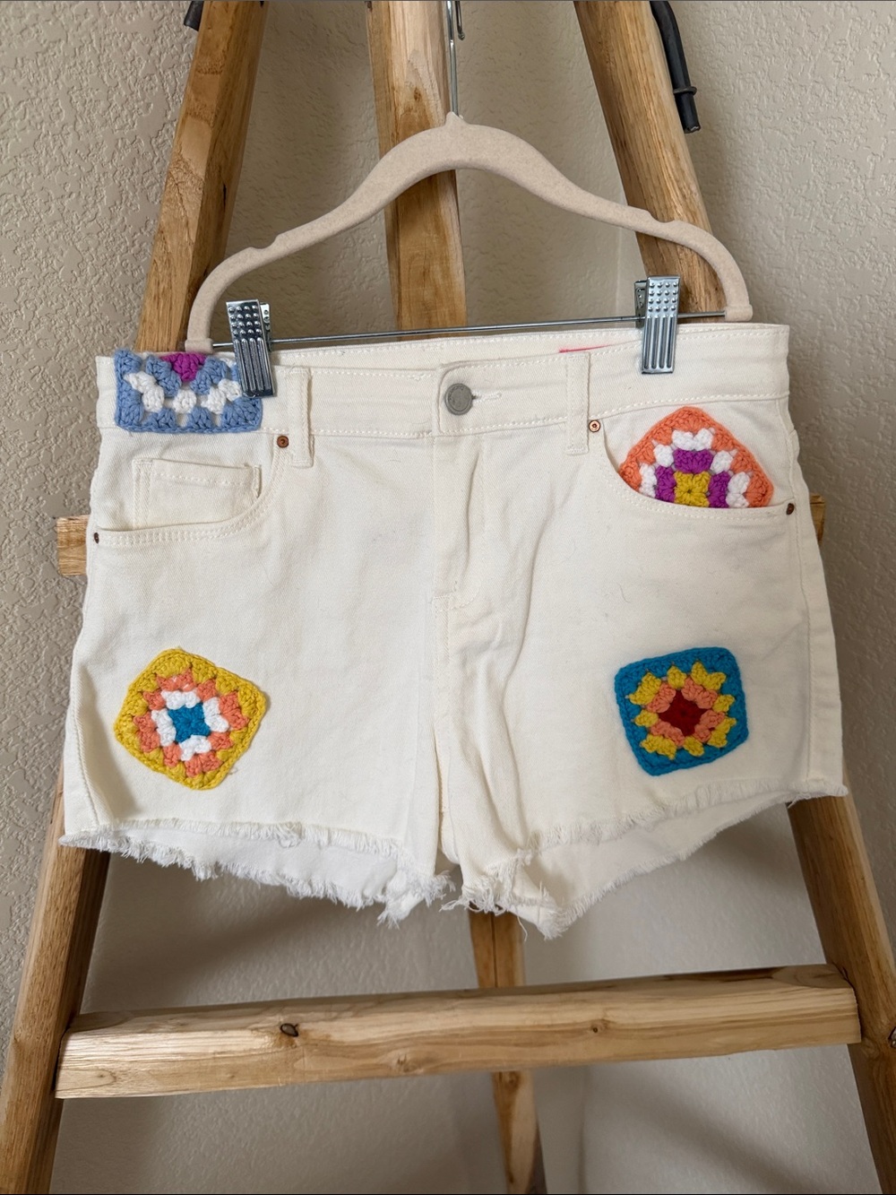 Blank NYC Cream Denim Shorts with Colorful Crochet Patches